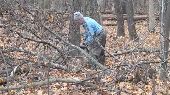 Dave Kline cutting up downed tree